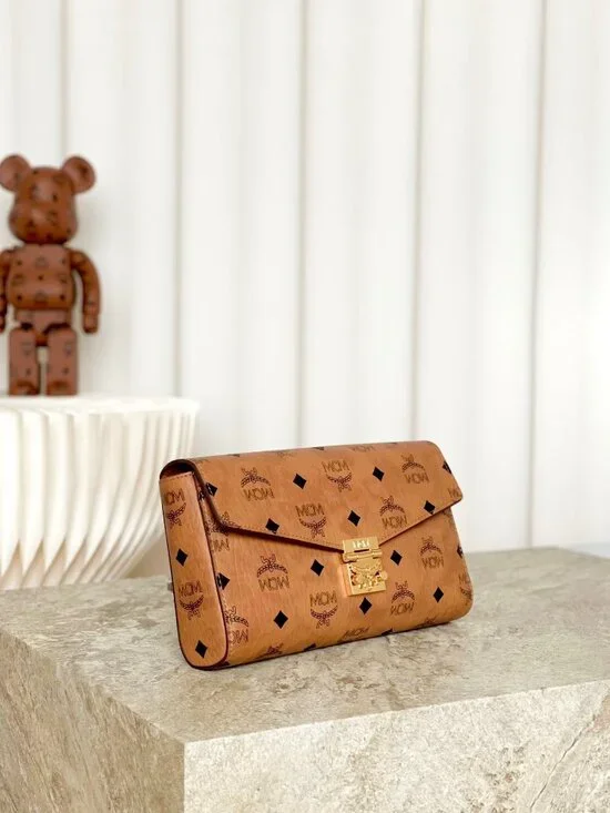 MCM Tan Monogram Clutch with Gold Accent - Picture 2 of 9